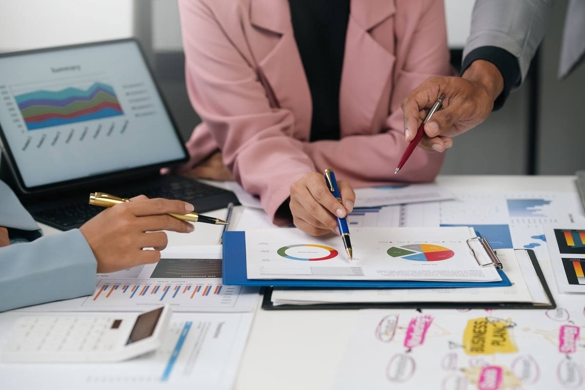 A group of professionals looking at data