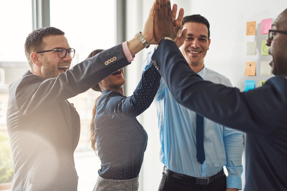 People high-fiving each other