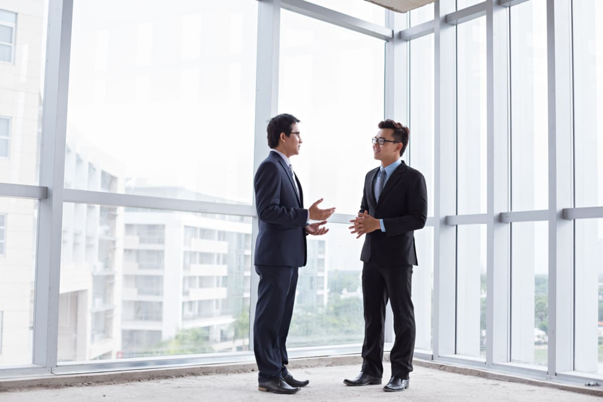 Two people talking in a commercial building